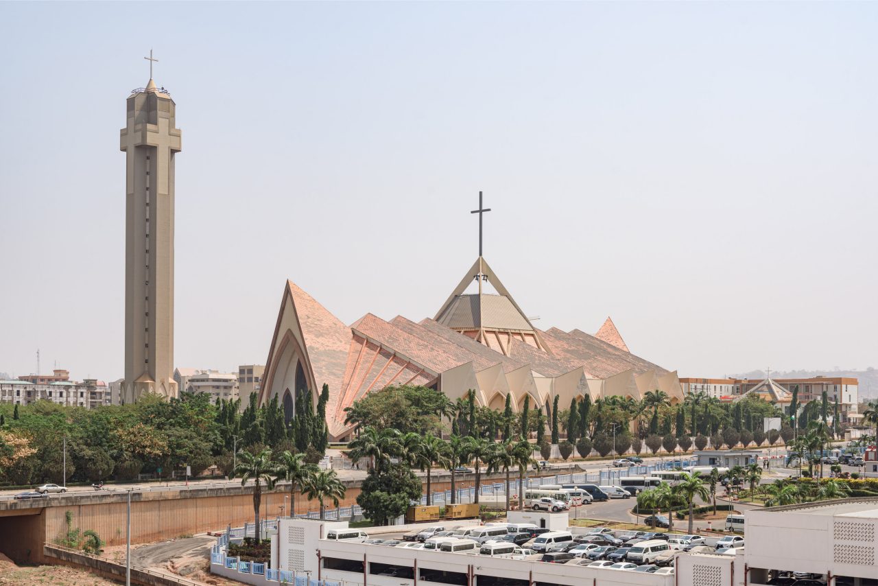 National Ecumenical center, a Christian building for religious ceremonies, in modern architecture style with spiked roof and cross shaped bell tower in Abuja, Federal Capital Territory, Nigeria